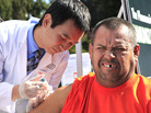 Ramon Maldonado-Cardenas grimaces as he gets a flu shot from pharmacy student Khoa Truong during a health fair in Sacramento, Calif., last October. Ramon Maldonado-Cardenas grimaces as he gets a flu shot from pharmacy student Khoa Truong during a health fair in Sacramento, Calif., last October.