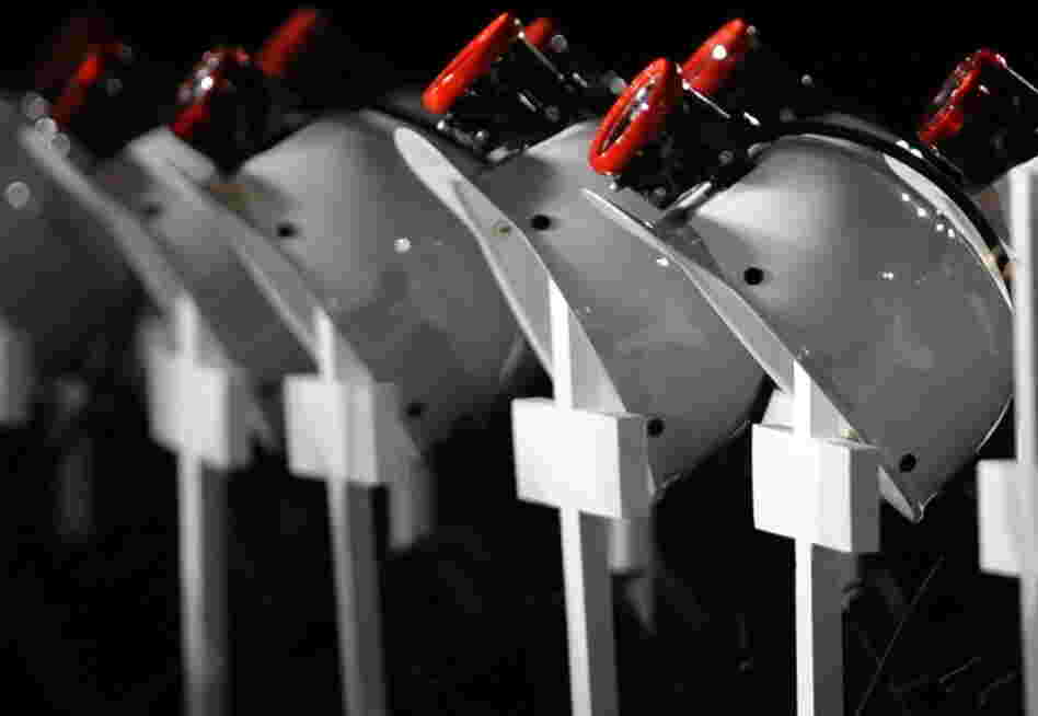 At an April 25, 2010, service in Beckley, W. Va., for the 29 miners killed in the Upper Big Branch explosion, helmets — placed on crosses — were lined up in their honor. 