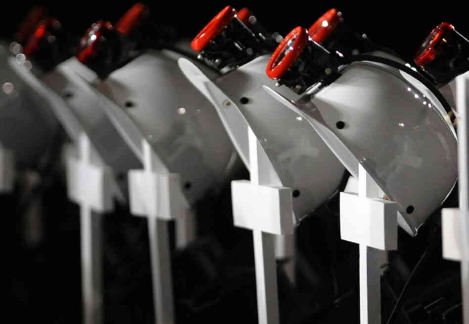 At an April 25, 2010, service in Beckley, W. Va., for the 29 miners killed in the Upper Big Branch explosion, helmets — placed on crosses — were lined up in their honor. 