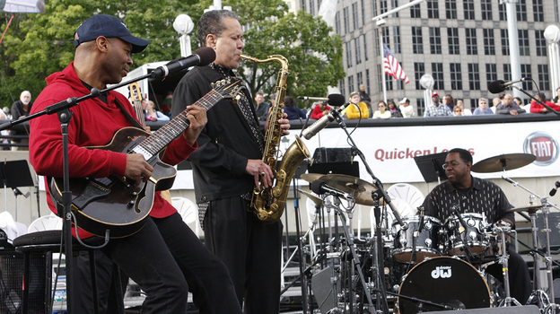 From left to right: Kevin Eubanks, Bill Pierce and Marvin Smitty Smith perform at the Detroit Jazz Festival.