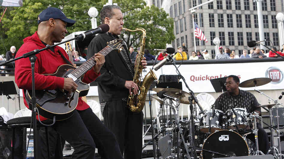 From left to right: Kevin Eubanks, Bill Pierce and Marvin Smitty Smith perform at the Detroit Jazz Festival.