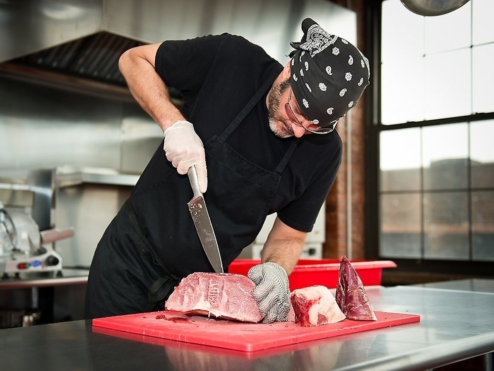 Every week, Robert Stout of Kings County Jerky slices meat by hand.