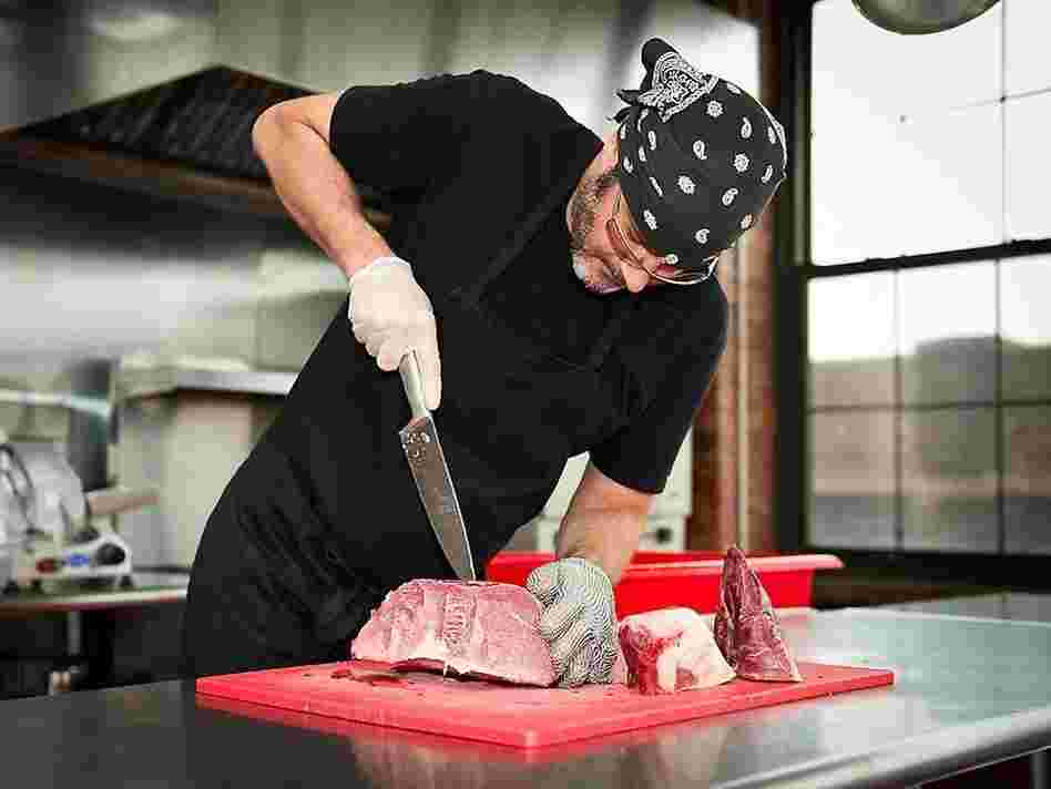Every week, Robert Stout of Kings County Jerky slices meat by hand.