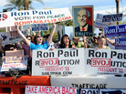 Fans of GOP presidential candidate Ron Paul show their support outside the Mesa Arts Center before Wednesday night's Republican debate in Mesa, Ariz. Fans of GOP presidential candidate Ron Paul show their support outside the Mesa Arts Center before Wednesday night's Republican debate in Mesa, Ariz.