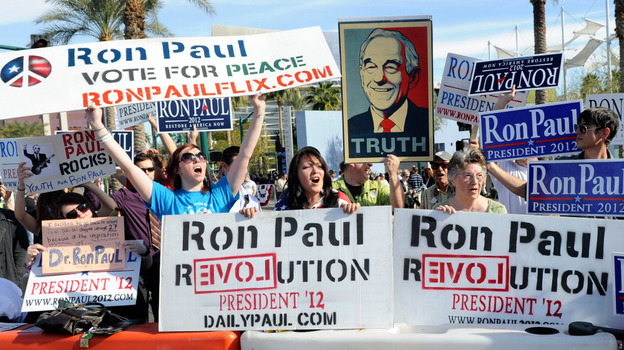 Fans of GOP presidential candidate Ron Paul show their support outside the Mesa Arts Center before Wednesday night's Republican debate in Mesa, Ariz.