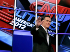 Former Massachusetts Gov. Mitt Romney waves to the crowd as he is introduced at the start of Wednesday night's Republican presidential debate in Mesa, Ariz. Former Massachusetts Gov. Mitt Romney waves to the crowd as he is introduced at the start of Wednesday night's Republican presidential debate in Mesa, Ariz.
