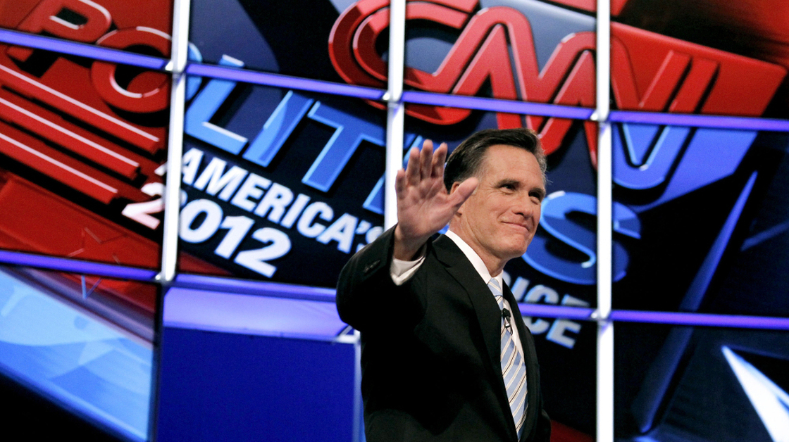 Former Massachusetts Gov. Mitt Romney waves to the crowd as he is introduced at the start of Wednesday night's Republican presidential debate in Mesa, Ariz.