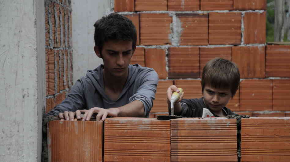 Nik (Tristan Halilaj, left) and his younger brother, Dren (Elsajed Tallalli), must both stay indoors to avoid violent retaliation after their father kills a member of another family. Nik (Tristan Halilaj, left) and his younger brother, Dren (Elsajed Tallalli), must both stay indoors to avoid violent retaliation after their father kills a member of another family.