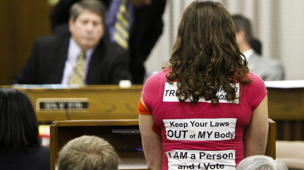  An abortion rights activist speaks before the Virginia Senate Education and Health Committee on Thursday. Following a protest outside the state capitol and criticism from moderates in his own party, Republican Gov. Bob McDonnell asked for revisions to a bill requiring an invasive ultrasound before an abortion. 