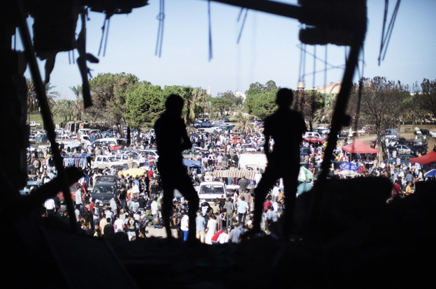 Libyans attend the Friday market the gardens inside the Bab al-Azizia compound in Tripoli, on Oct. 28, 2011. 