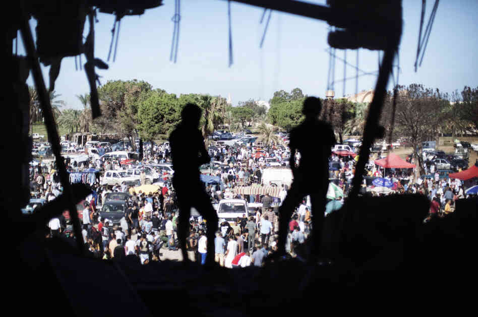 Libyans attend the Friday market the gardens inside the Bab al-Azizia compound in Tripoli, on Oct. 28, 2011. 