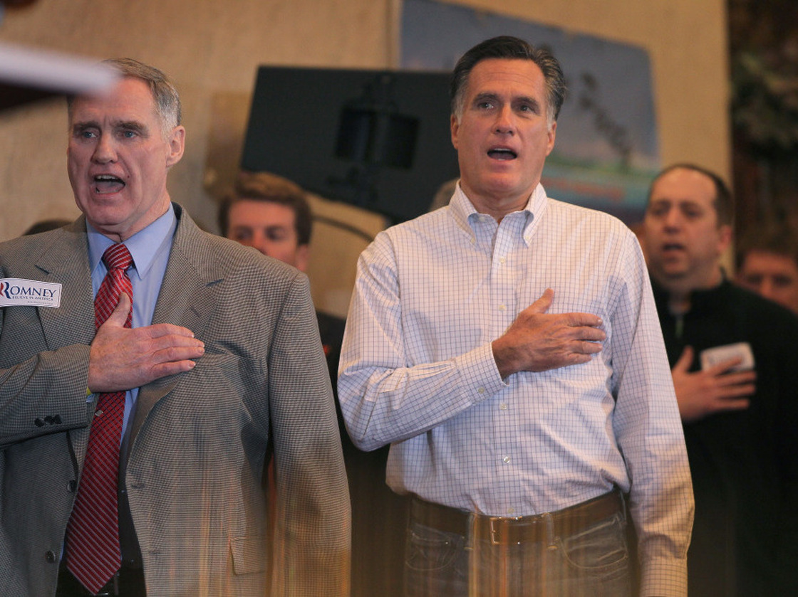 Mitt Romney sings the national anthem before speaking at a Tea Party event at the Bakers of Milford Banquet Hall on Thursday in Milford, Mich. 