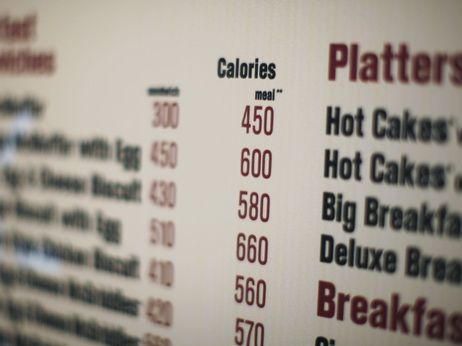 Calorie counts like the one on this McDonald's drive-thru in New York are intended to help people make healthier choices. But researchers say they're often too confusing. Calorie counts like the one on this McDonald's drive-thru in New York are intended to help people make healthier choices. But researchers say they're often too confusing.
