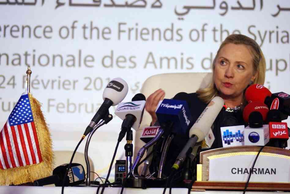 Secretary of State Hillary Clinton speaks during a press conference at a conference on Syria in Tunis, Tunisia, on Friday. The participants were united in their calls for a ceasefire and for Syrian President Bashar Assad to allow humanitarian aid into his country.