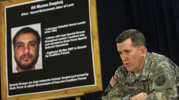 U.S. Brig. Gen. Kevin Bergner speaks in Baghdad in July 2007 near a poster of Ali Musa Daqduq. Daqduq was captured in Iraq in March 2007, and is accused of orchestrating the killings of five U.S. soldiers. The U.S. left Daqduq in Iraqi custody when U.S. troops formally withdrew in December. But the Obama administration is seeking to try him before a military commission.