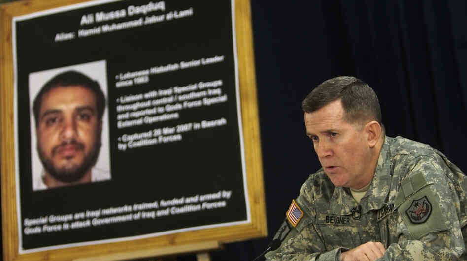 U.S. Brig. Gen. Kevin Bergner speaks in Baghdad in July 2007 near a poster of Ali Musa Daqduq. Daqduq was captured in Iraq in March 2007, and is accused of orchestrating the killings of five U.S. soldiers. The U.S. left Daqduq in Iraqi custody when U.S. troops formally withdrew in December. But the Obama administration is seeking to try him before a military commission.