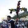 A Coptic Christian man holds a cross made of flowers during a clash between Christians and Muslims in Cairo in November. Relations are becoming more strained between the two communities, and there has been periodic violence. A Coptic Christian man holds a cross made of flowers during a clash between Christians and Muslims in Cairo in November. Relations are becoming more strained between the two communities, and there has been periodic violence.
