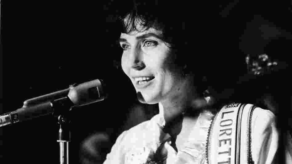 American country music singer and guitarist Loretta Lynn performs on stage at the Grand Ole Opry, 1960s.