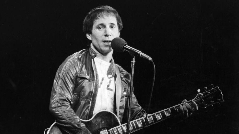 Paul Simon performing in London.