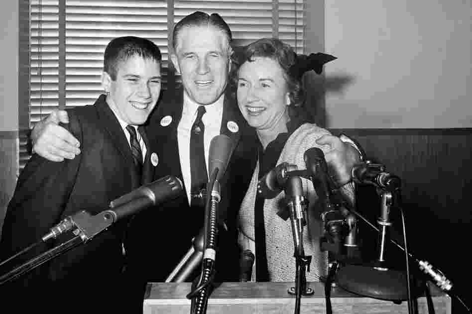 Flanked by his wife, Lenore, and son Mitt, George Romney announces his run for governor of Michigan at a news conference in 1962. 