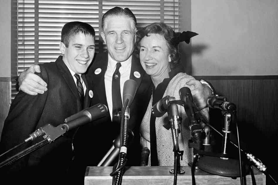 Flanked by his wife, Lenore, and son Mitt, George Romney announces his run for governor of Michigan at a news conference in 1962. 