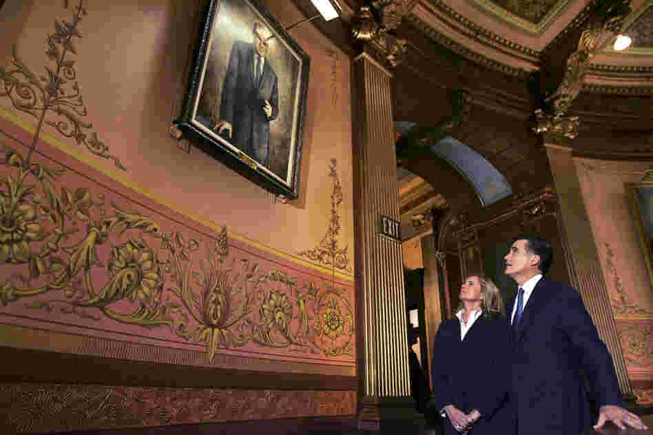 Mitt Romney and his wife, Ann, look up at a portrait of his late father at the Capitol rotunda in Lansing, Mich., in 2008. 
