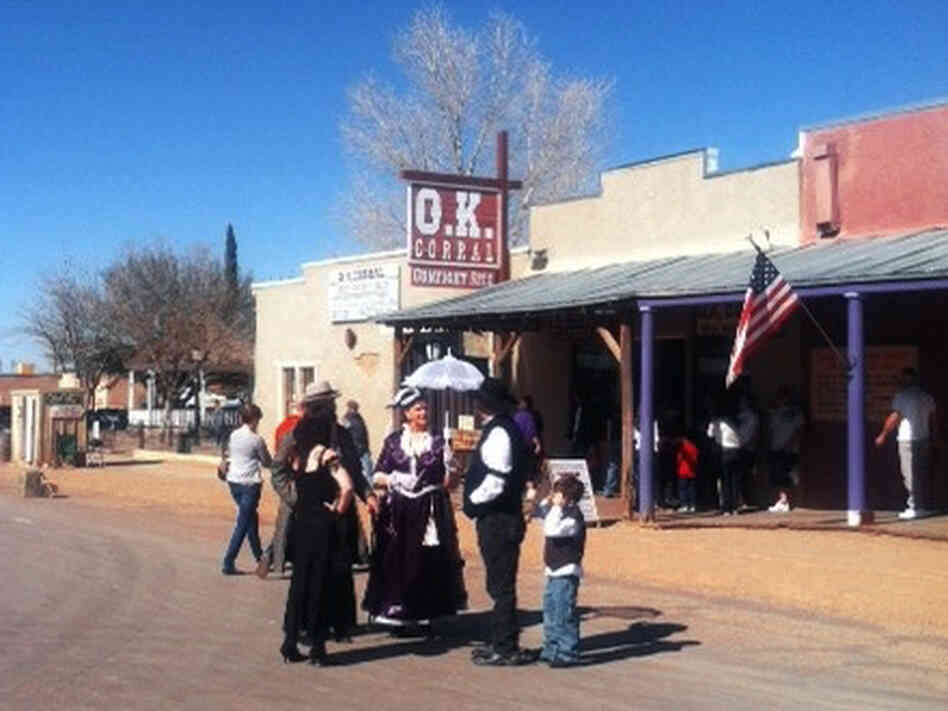 Tourists in Tombstone visit the O.K. Corral exhibits. Tourists in Tombstone visit the O.K. Corral exhibits.
