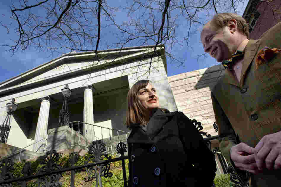 Christina Bevilacqua (left), director of programs and public engagement, and James Hall, executive director of the Providence Preservation Society, stand outside the Providence Athenaeum. 