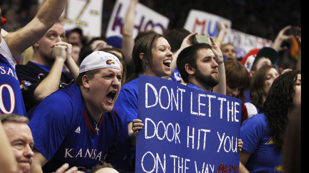 Kansas fans celebrate during the second half of an NCAA college basketball game against Missouri in Lawrence, Kan., on Saturday. Kansas defeated Missouri 87-86 in overtime.