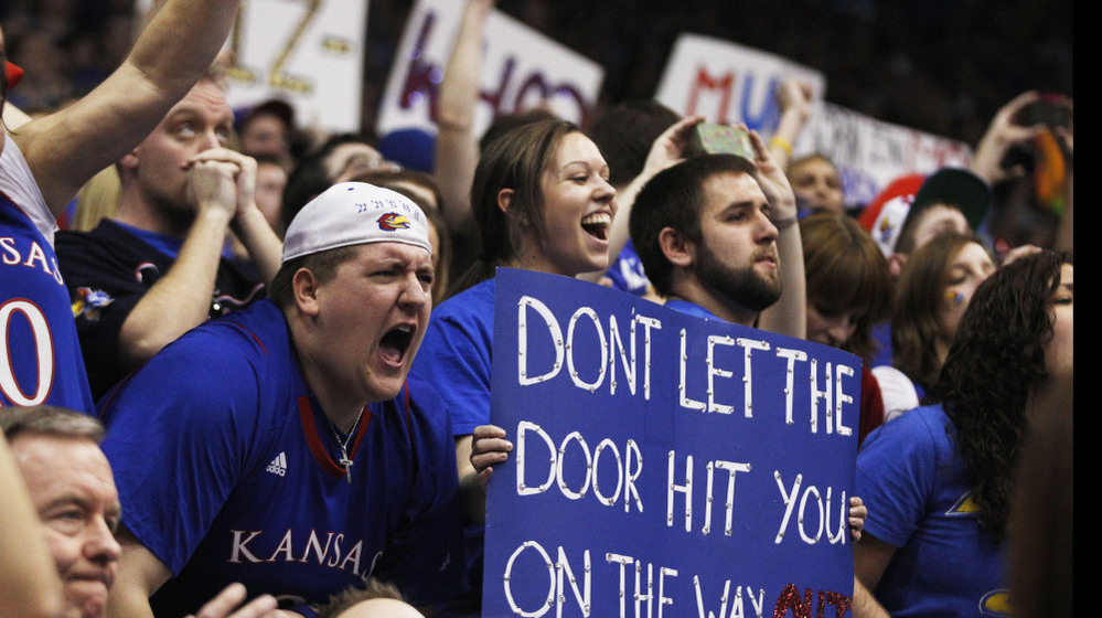Kansas fans celebrate during the second half of an NCAA college basketball game against Missouri in Lawrence, Kan., on Saturday. Kansas defeated Missouri 87-86 in overtime.