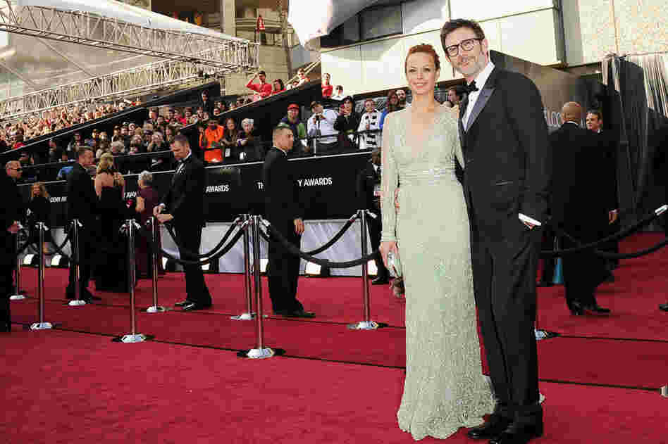 Berenice Bejo, nominated for Best Supporting Actress for her role in The Artist, and the film's writer-director Michel Hazanavicius, nominated for Best Director, arrive at the Academy Awards. 