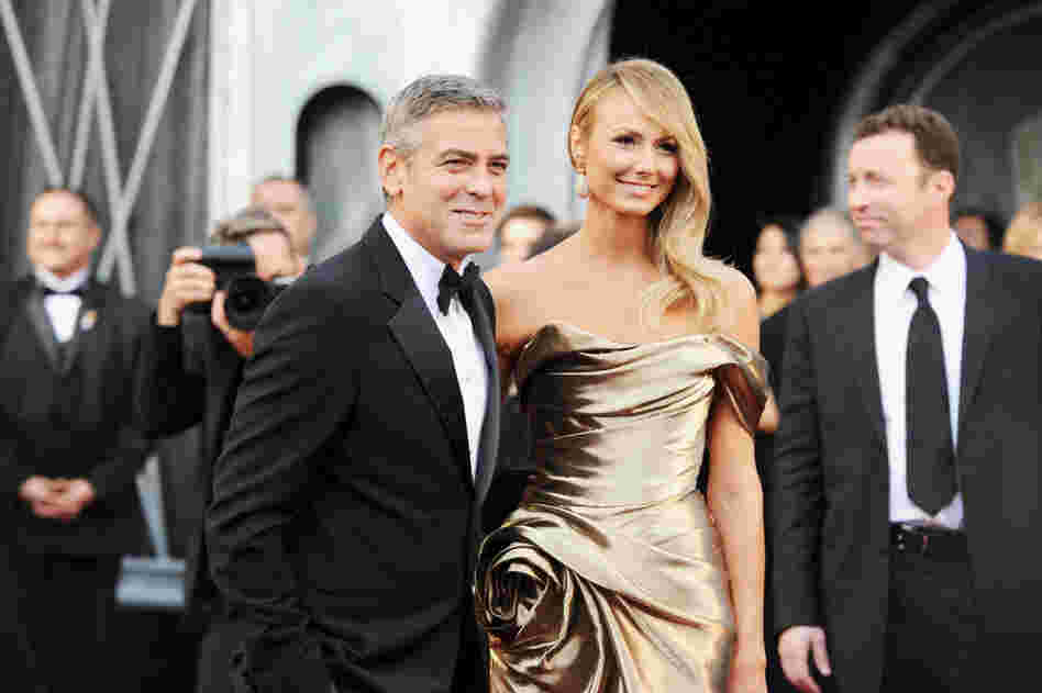 George Clooney, nominated for Best Actor for his role in The Descendants, and his girlfriend, Stacy Kiebler, do the red carpet ritual at the Academy Awards. 