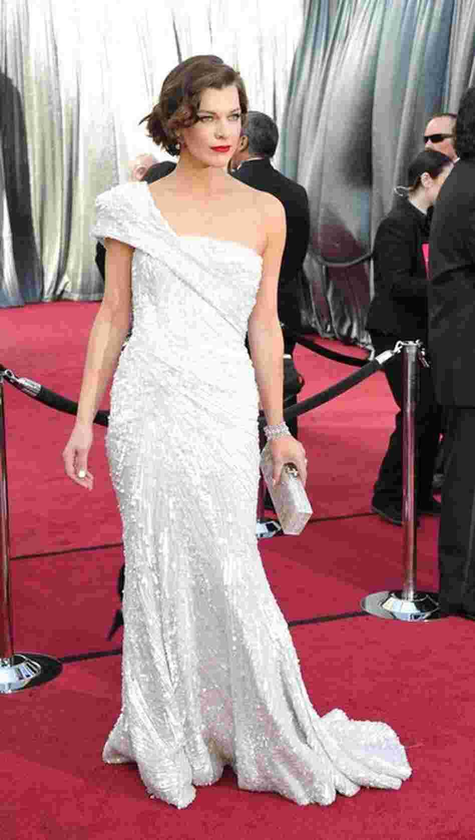 Milla Jovovich, scheduled to present at the ceremony, dazzled red-carpet watchers in an Elie Saab gown. 