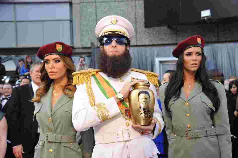 Sacha Baron Cohen came dressed as his character in the upcoming film The Dictator — and spilled "ashes" from the urn on Ryan Seacrest during an interview on E! 