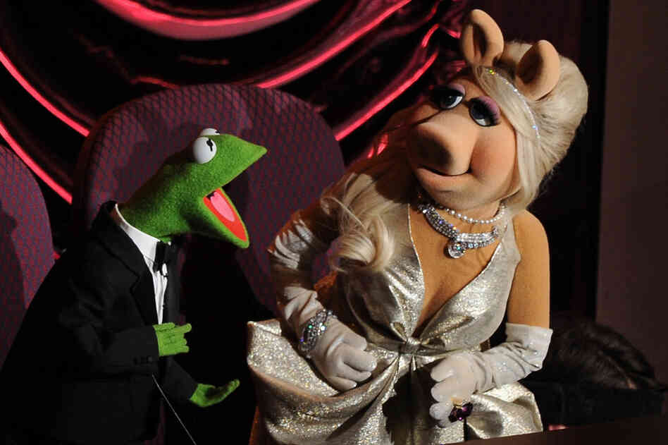 Beloved "Muppets" stars Kermit the Frog and Miss Piggy banter during the awards ceremony. "Man or Muppet" won Bret McKenzie the Oscar for Best Original Song. 
