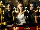 Oscar fans in New York take a closer look at the statuettes on display during the "Meet the Oscars, Grand Central" exhibition at Grand Central Station on Feb. 22. Oscar fans in New York take a closer look at the statuettes on display during the "Meet the Oscars, Grand Central" exhibition at Grand Central Station on Feb. 22.