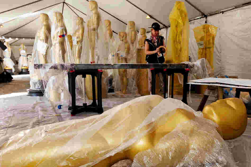 Lead scenic artist, Dena D'Angelo works on the finishing touches for the set of the awards show outside the Kodak Theatre. 