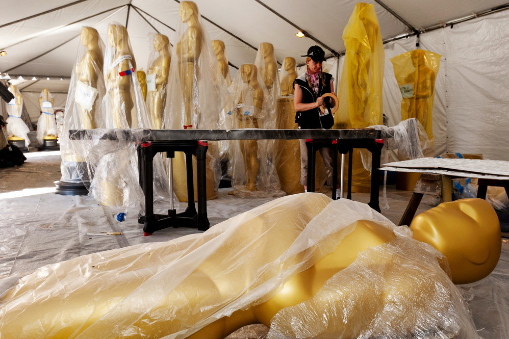 Lead scenic artist, Dena D'Angelo works on the finishing touches for the set of the awards show outside the Kodak Theatre. 