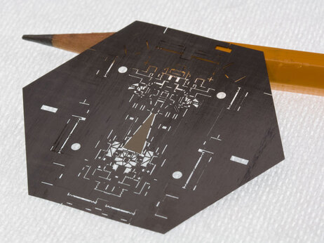 A laser-milled sheet of carbon fiber, one layer of the stack that makes up a Mobee. A laser-milled sheet of carbon fiber, one layer of the stack that makes up a Mobee.