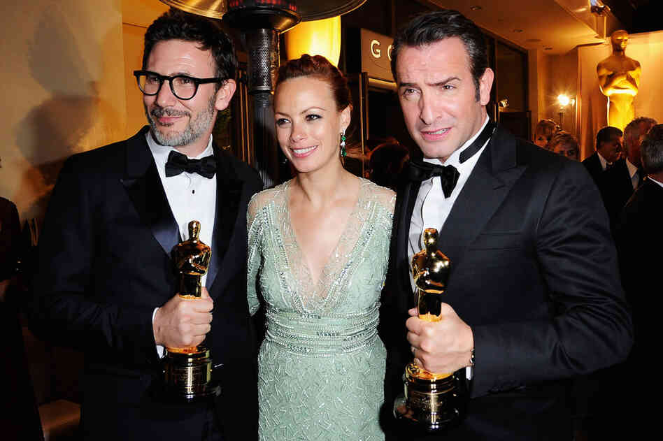 Director Michel Hazanavicius (from left), who won Best Director for the black-and-white silent film "The Artist," poses with stars of the film Berenice Bejo and Jean Dujardin, who won Best Actor. 