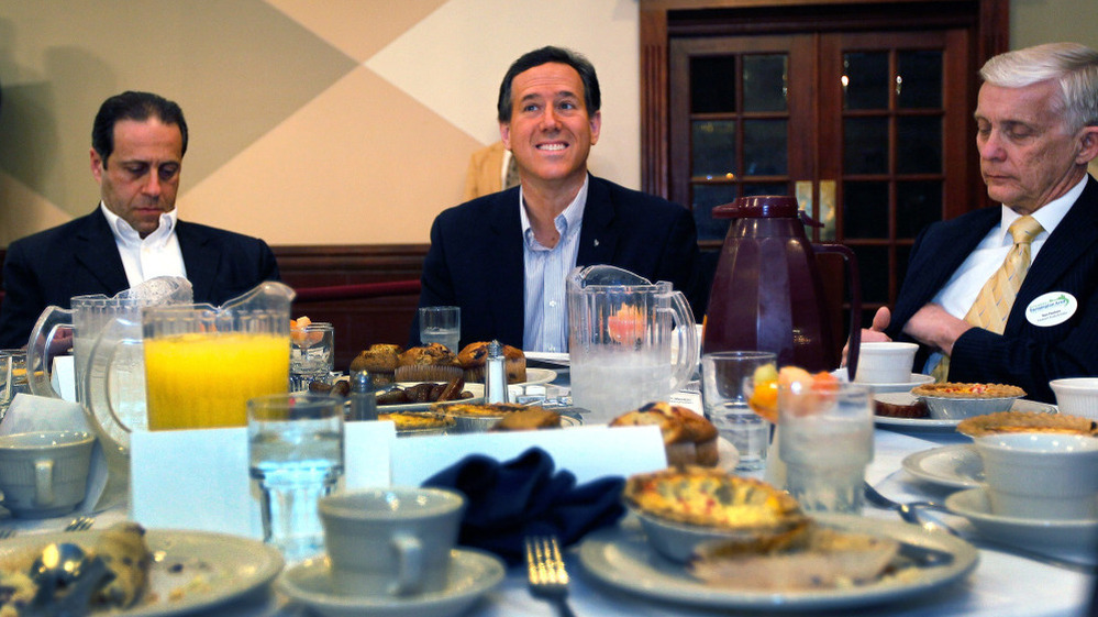 Rick Santorum (center) Monday at St. Mary's Cultural & Banquet Center in Livonia, Mich. 