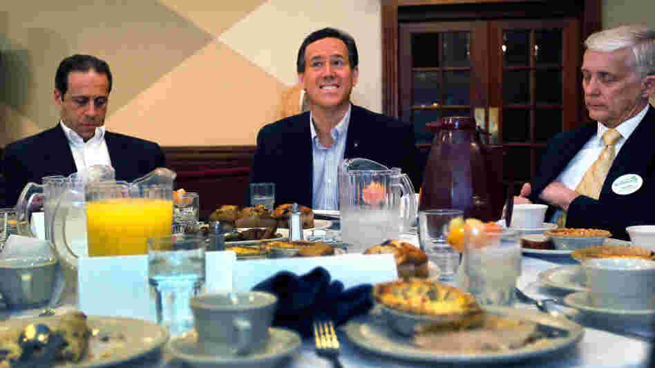 Rick Santorum (center) Monday at St. Mary's Cultural & Banquet Center in Livonia, Mich. 
