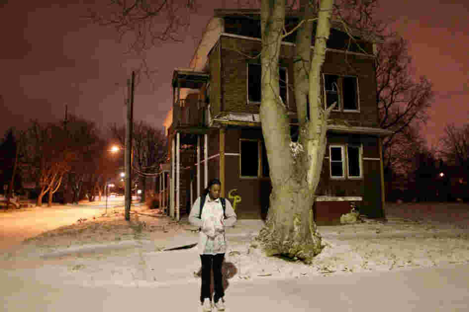 Aspiring Olympic boxer Claressa Shields, 16, waits in front of an abandoned house for the morning school bus in her hometown of Flint, Mich.