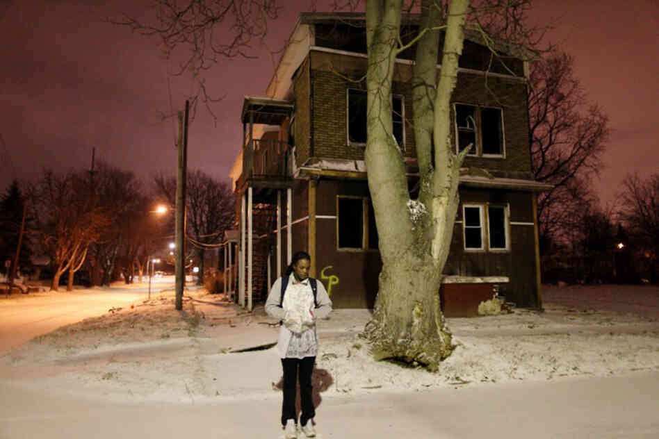 Aspiring Olympic boxer Claressa Shields, 16, waits in front of an abandoned house for the morning school bus in her hometown of Flint, Mich.
