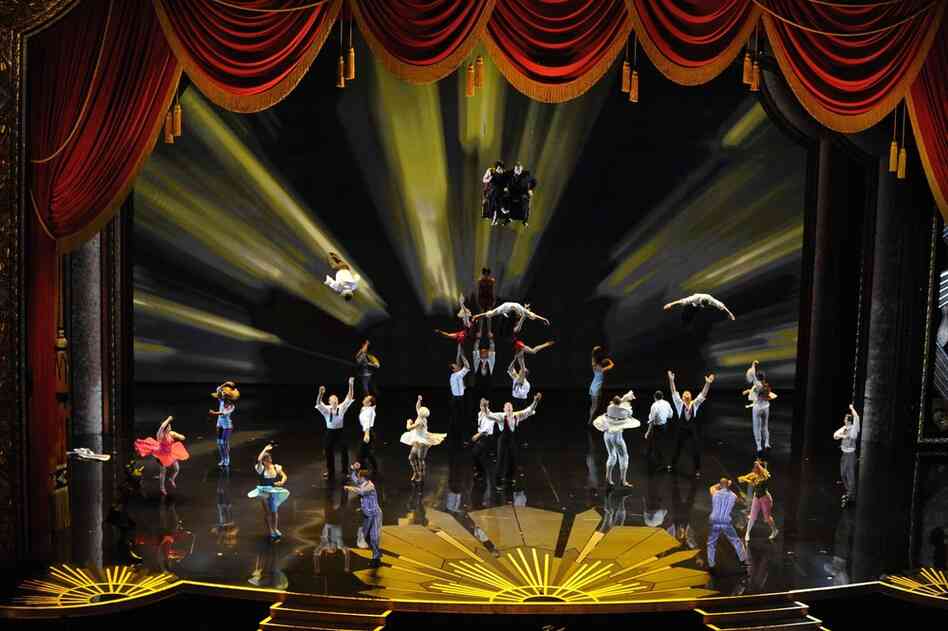 In an airborne homage to movie-making, Cirque du Soleil performers flew and flipped for the audience assembled at the Hollywood & Highland Center. 