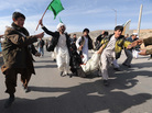 The latest violence in Afghan has raised doubts about the U.S. strategy. Here, Afghan demonstrators shout anti-U.S. slogans as they carry a wounded man during a protest in the Western city of Herat on Feb. 24. The latest violence in Afghan has raised doubts about the U.S. strategy. Here, Afghan demonstrators shout anti-U.S. slogans as they carry a wounded man during a protest in the Western city of Herat on Feb. 24.