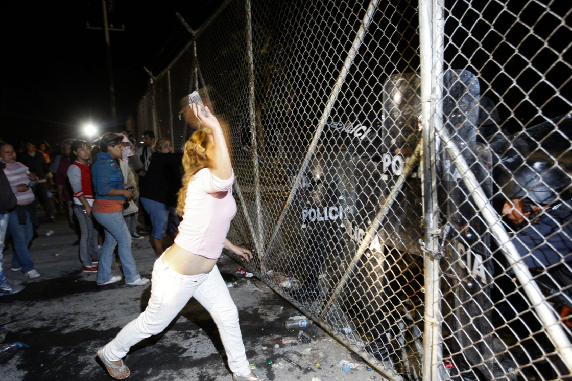 In northern Mexico, relatives of inmates at Apodaca prison outside Monterrey attack the security fence, Feb. 21. Violence at the prison on Feb. 19 left 48 inmates dead; the transfer of three prisoners to another criminal center prompted more violence two days later. 
