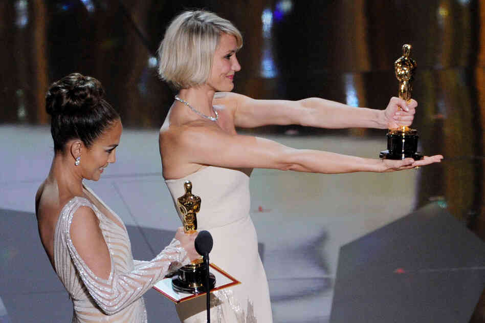 Presenters Jennifer Lopez (left) and Cameron Diaz present the awards for Best Costume (Mark Bridges, "The Artist") and Best Makeup 