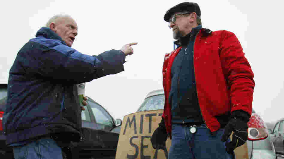 Chris McDonough, a Republican (left), and Robert O'Brien, a Democrat, argue about political issues outside a caucus in Portland, Maine, in February.