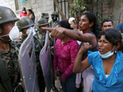In Honduras, female relatives of inmates killed during a fire at a prison argue with soldiers as they try to enter the morgue in Tegucigalpa, the Honduran capital, on Feb. 20. The fire at Comayagua prison on Feb. 14 killed more than 300 inmates. In Honduras, female relatives of inmates killed during a fire at a prison argue with soldiers as they try to enter the morgue in Tegucigalpa, the Honduran capital, on Feb. 20. The fire at Comayagua prison on Feb. 14 killed more than 300 inmates.